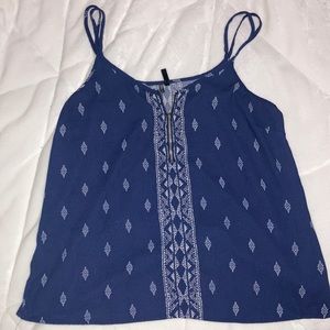 L Maurice’s navy blue tank top